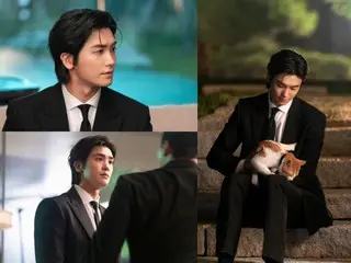 Park Hyung Sik (ZE:A) mengenakan setelan jas sambil menggendong kucing di "Buried Heart"... Krisis dari episode pertama